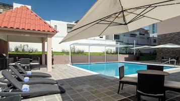Outdoor pool, pool umbrellas, sun loungers