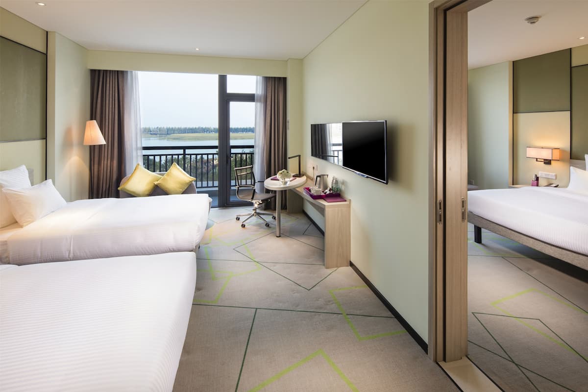 deluxe room, 1 king bed, lake view | living area | 40-inch led tv with cable channels, tv