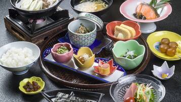 A variety of traditional Japanese dishes arranged on a table.