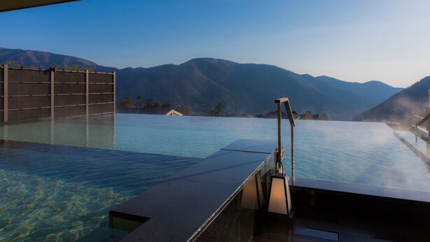 An infinity pool with a view of mountains.