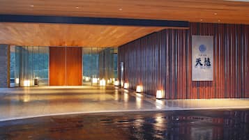 Experience the vibrant atmosphere of this building, featuring a striking lantern-lit facade and a prominent Chinese sign.