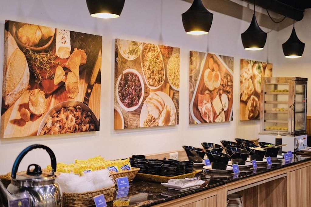 A buffet area with various food items and black serving dishes.
