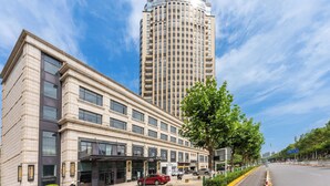 A modern hotel with a prominent 'MODENA' sign, a classic facade, and a tree-lined street. - Modena by Fraser Zhuankou Wuhan (Wuhan)