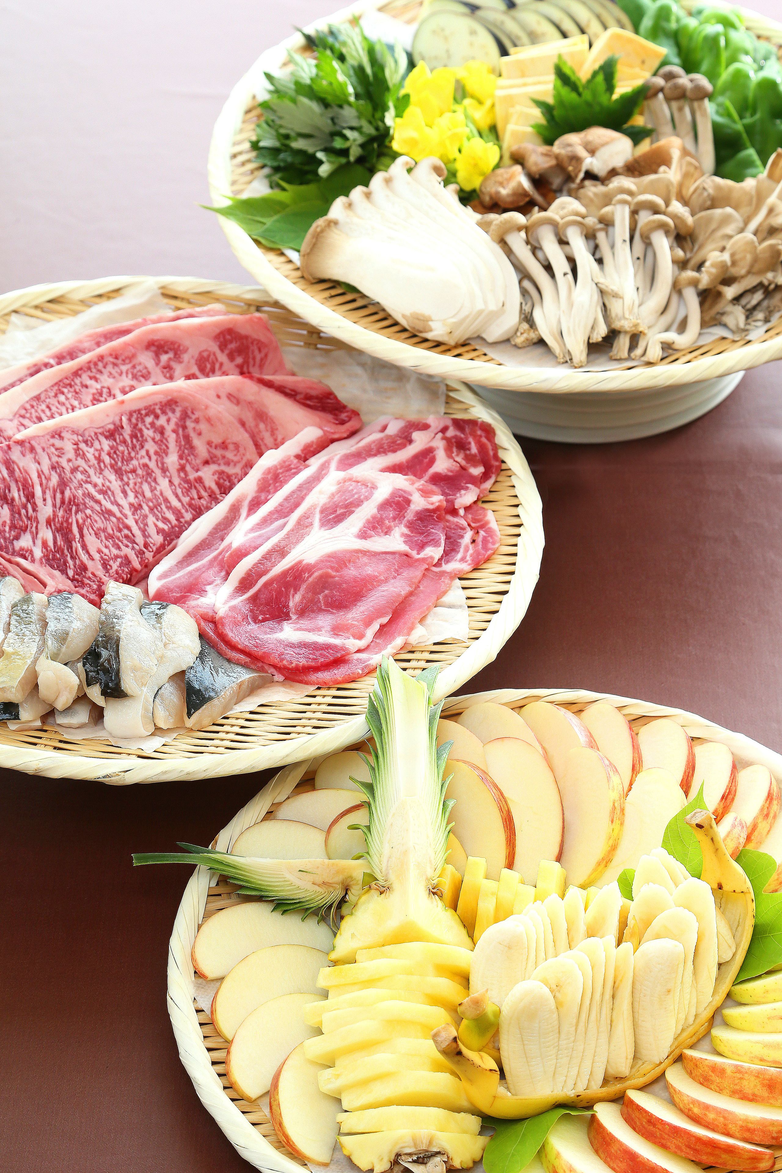 Three woven baskets filled with various food items, including meat, mushrooms, and fruits.