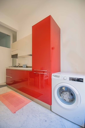 Deluxe Room, Balcony | Private kitchen | Fridge, dining tables