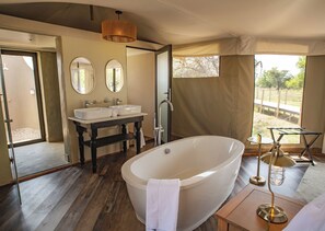Luxury Tent | Bathroom | Designer toiletries, hair dryer, bathrobes, slippers