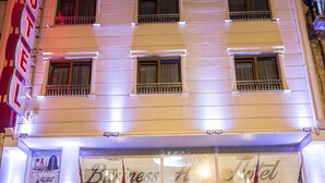 A hotel with a reception area, a sign reading "Hotel Business Han," and a visible entrance. - Hotel Business Han (Nevsehir)