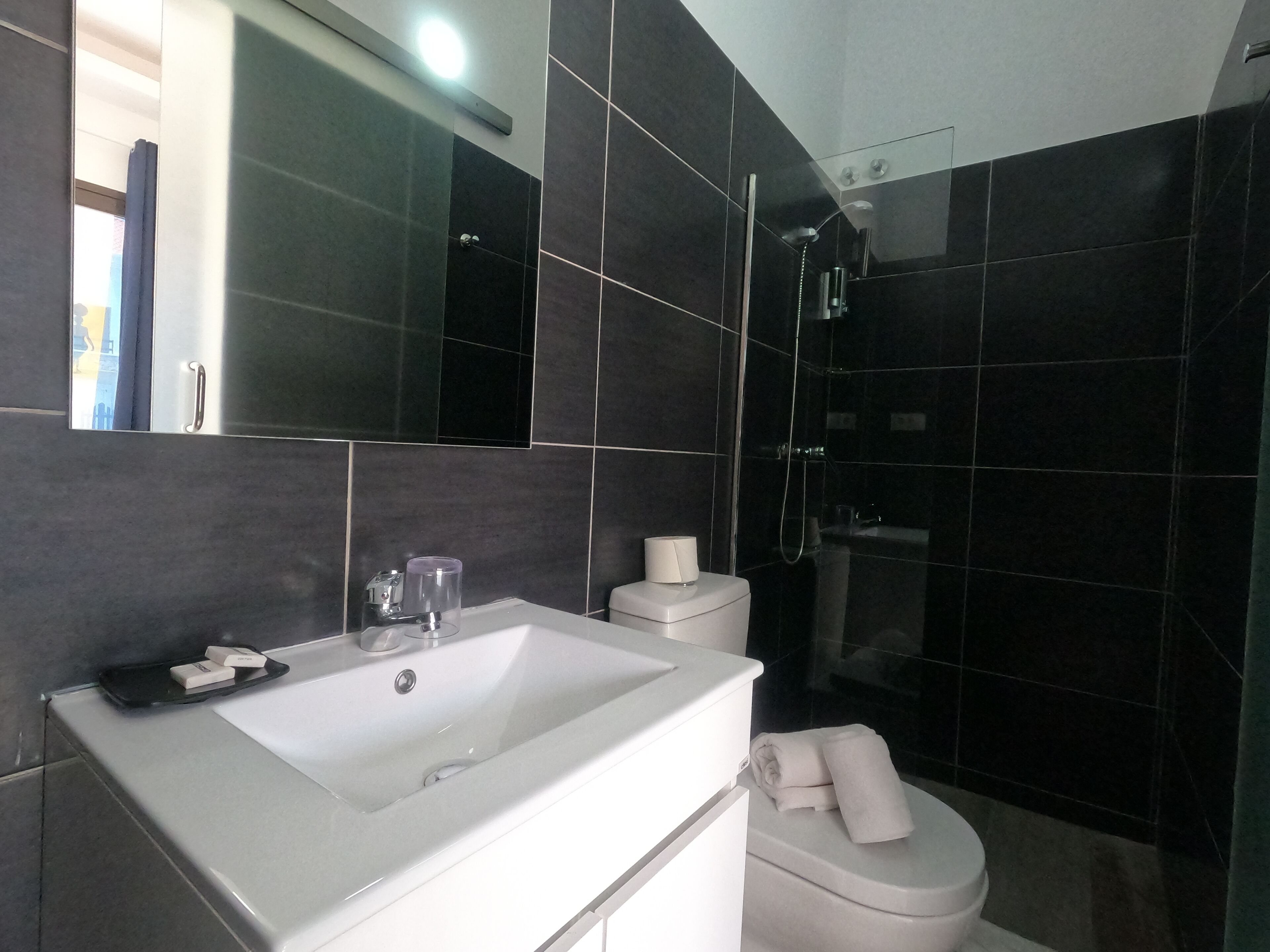 economy double room | bathroom | shower, free toiletries, hair dryer, towels