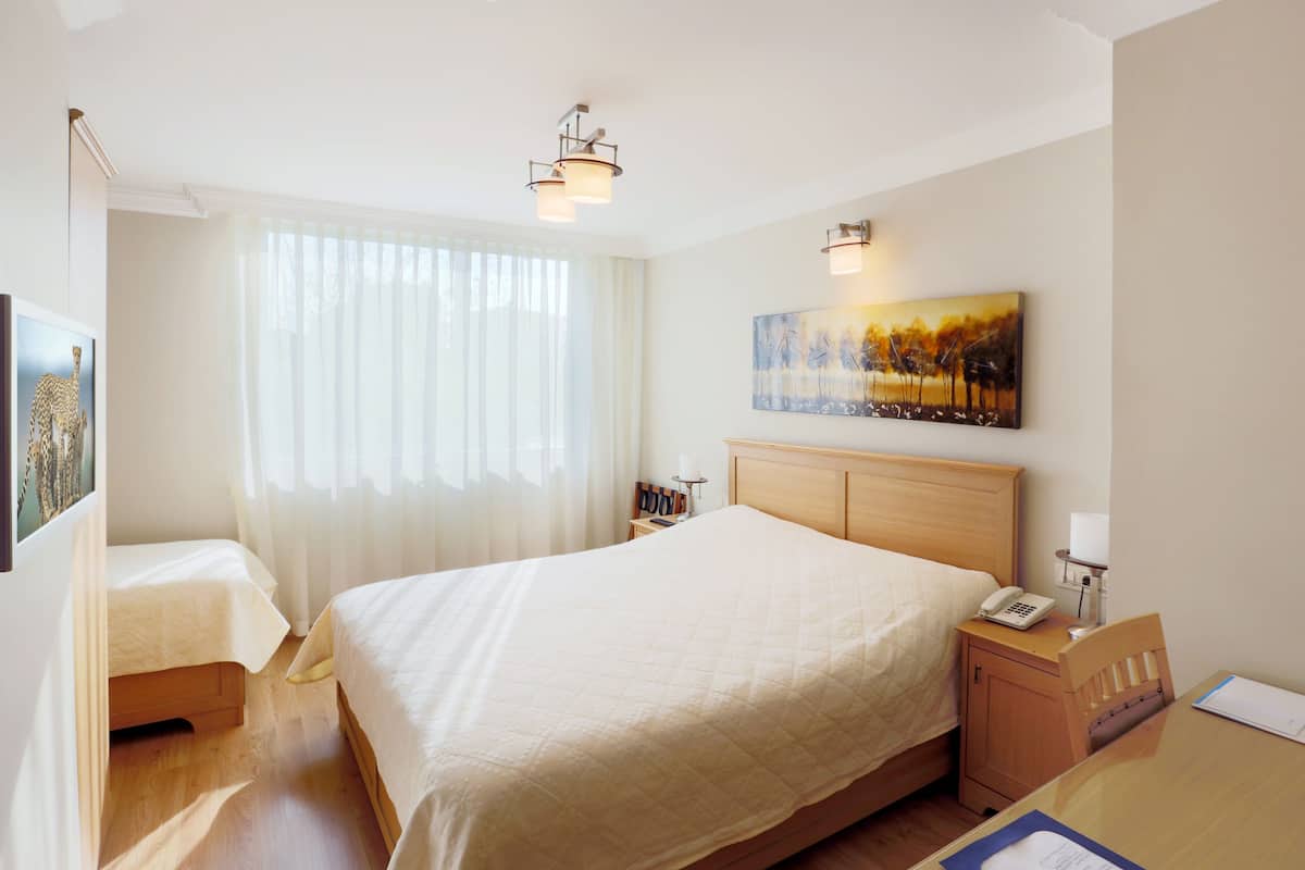 Family Triple Room | Minibar, in-room safe, desk, soundproofing