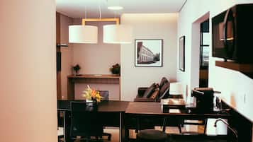 Platinum Double - Double bed | Living area | 40-inch flat-screen TV with cable channels, TV