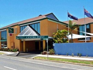 A building with a sign reading 'Centre Point' and flags on top. - Centrepoint Motor Inn (Rockhampton)