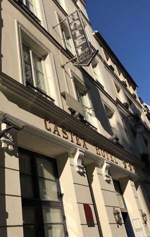 The exterior of the Castex Hotel with its classic architecture and signage. - Castex Hotel (Paris)