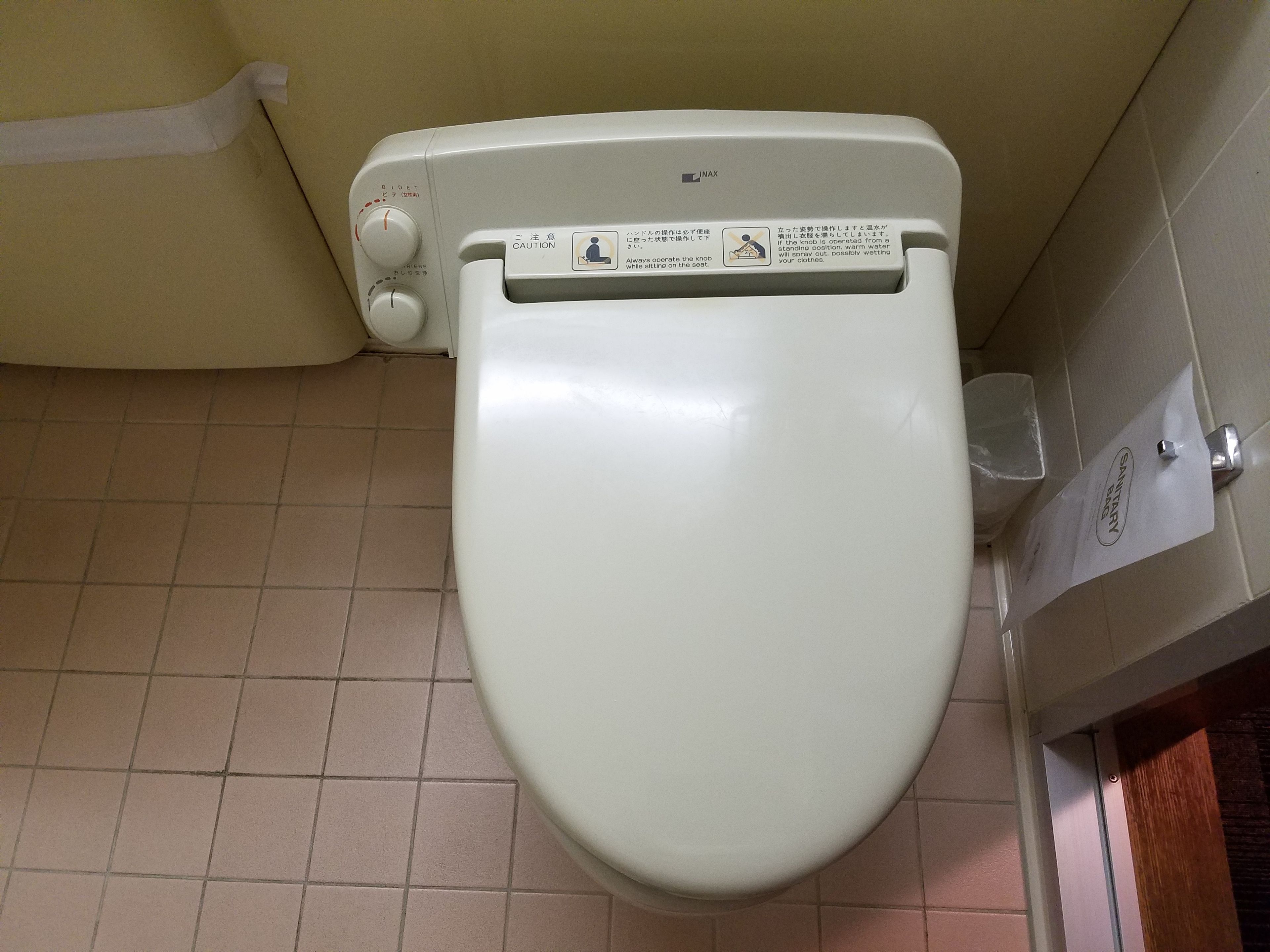 combined shower/bathtub, deep-soaking bathtub, hair dryer, slippers