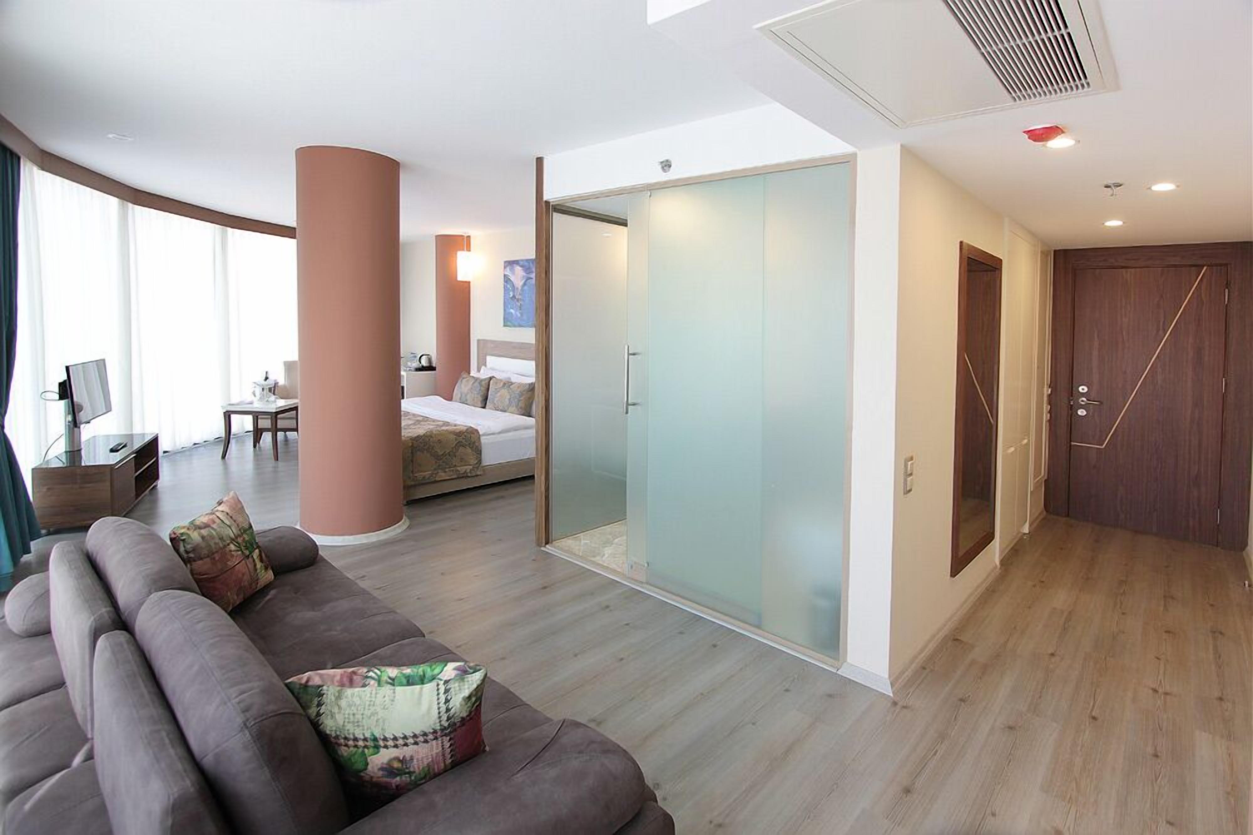 comfort studio suite, city view | living area | lcd tv