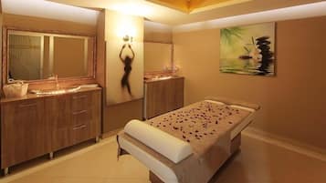 A spa room with a massage table, wooden cabinets, a large mirror, and a painting of a tranquil scene.