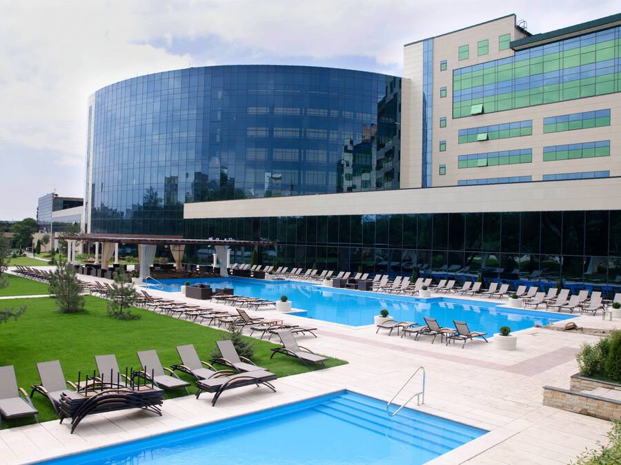 Indoor pool, outdoor pool, pool umbrellas, pool loungers