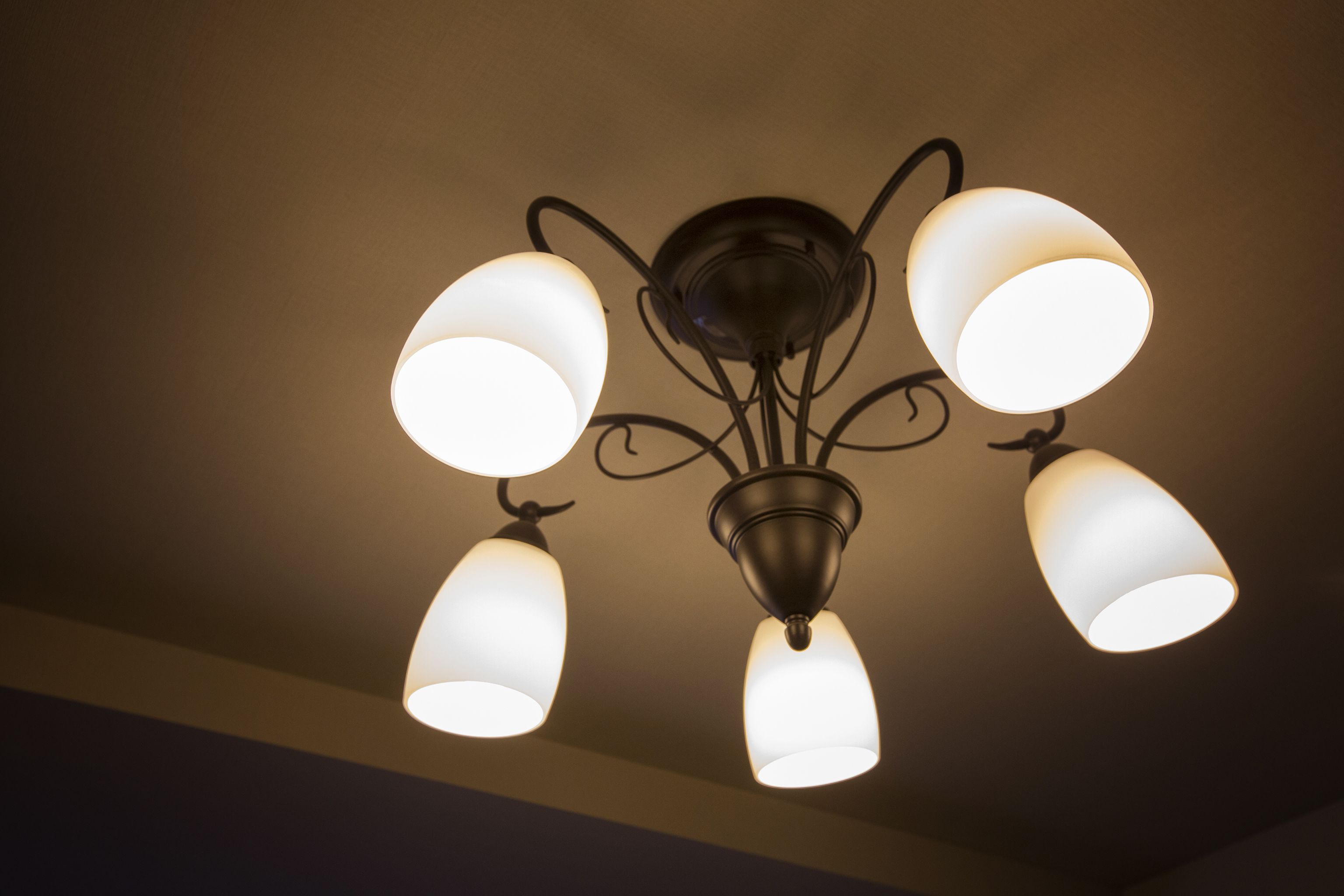 A ceiling light fixture with four lamps.
