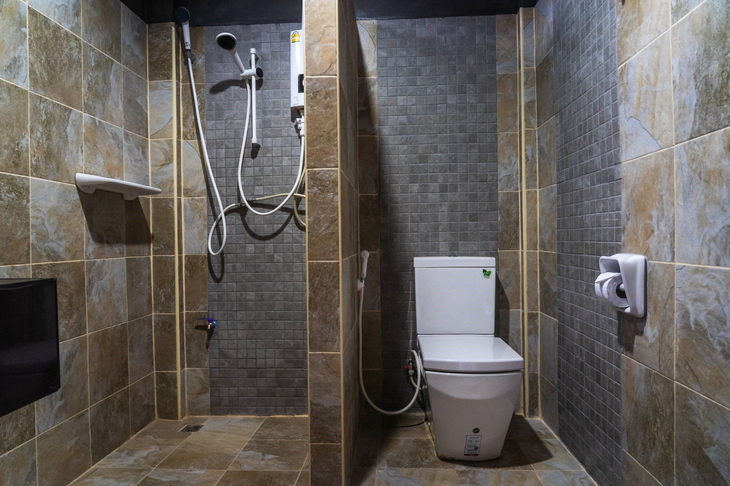 deluxe triple room | bathroom | shower, free toiletries, hair dryer, towels