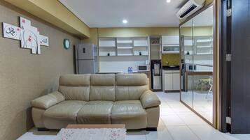 Family Suite, 3 Bedrooms, Ensuite, Pool View | Living area | 32-inch LCD TV with cable channels, TV