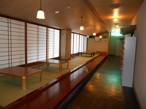 A traditional Japanese room with tatami flooring, low wooden tables, and shoji screens. - kinugawaonsen Fukumatsu (Nikko)