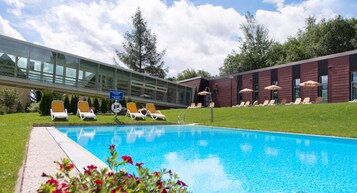 Indoor pool, seasonal outdoor pool, pool umbrellas, sun loungers