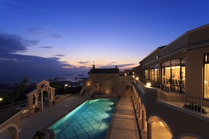 Seasonal outdoor pool, open 7:00 AM to 7:00 PM, pool umbrellas