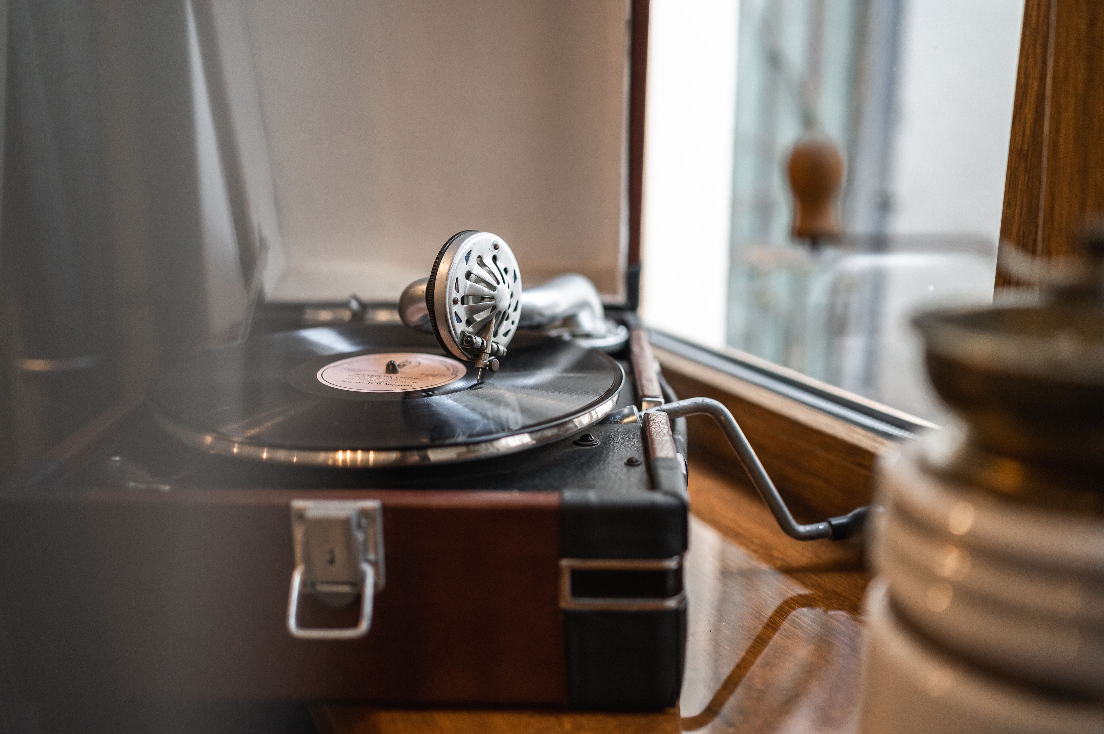 A vintage record player on a wooden surface.