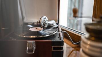 A vintage record player on a wooden surface.