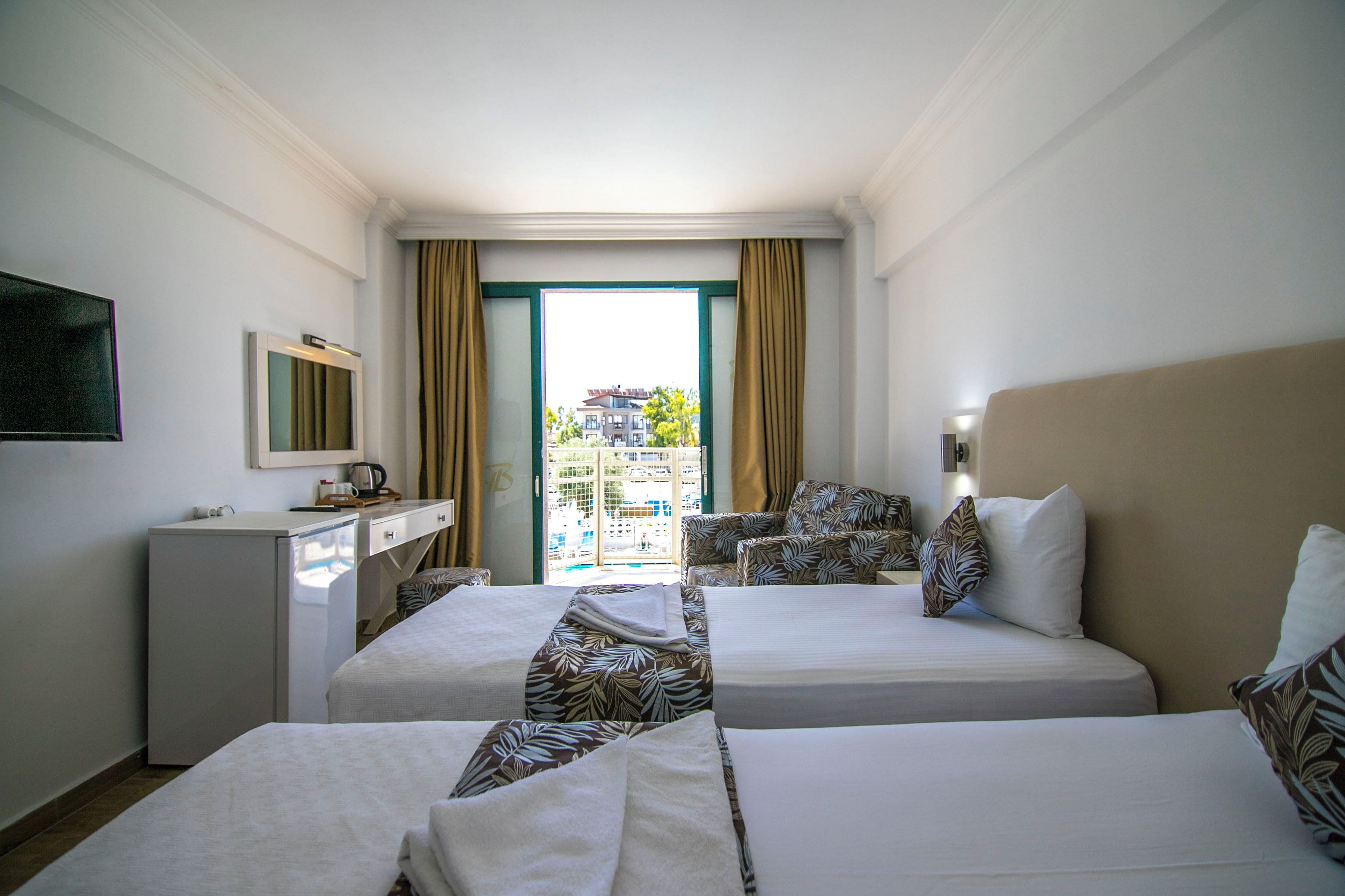 standard double or twin room, pool view | minibar, in-room safe, iron/ironing board, free wifi