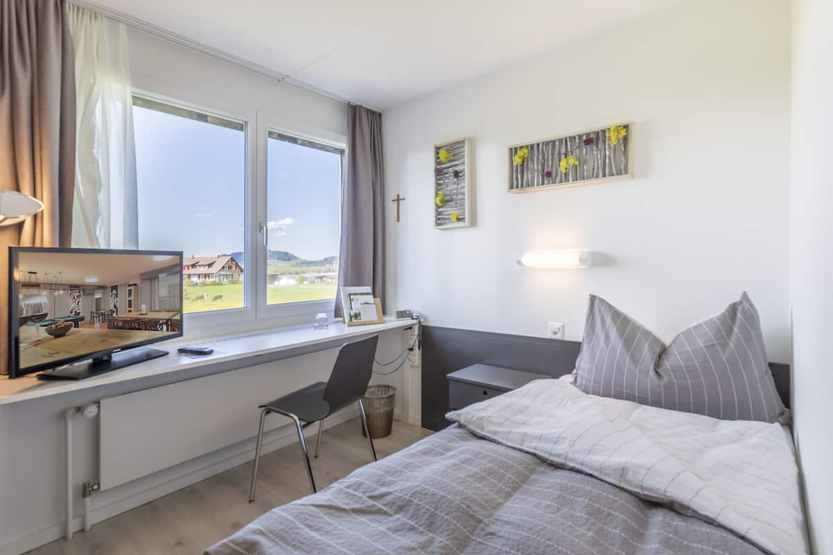 classic single room, 1 bedroom, private bathroom, garden view | 1 bedroom, blackout curtains, iron/ironing board, free wifi