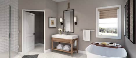 A modern bathroom with a large bathtub, a vanity with a mirror, and a shower area.