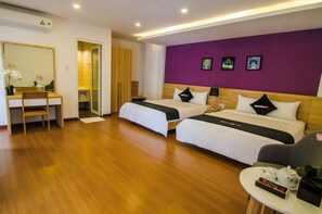 A hotel room with two beds, a desk, and a chair. - Son Tra Hill Phu Quoc (Phu Quoc)