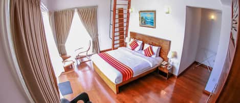 A bedroom with a wooden bed, a nightstand, a chair, a ladder, and a painting on the wall.