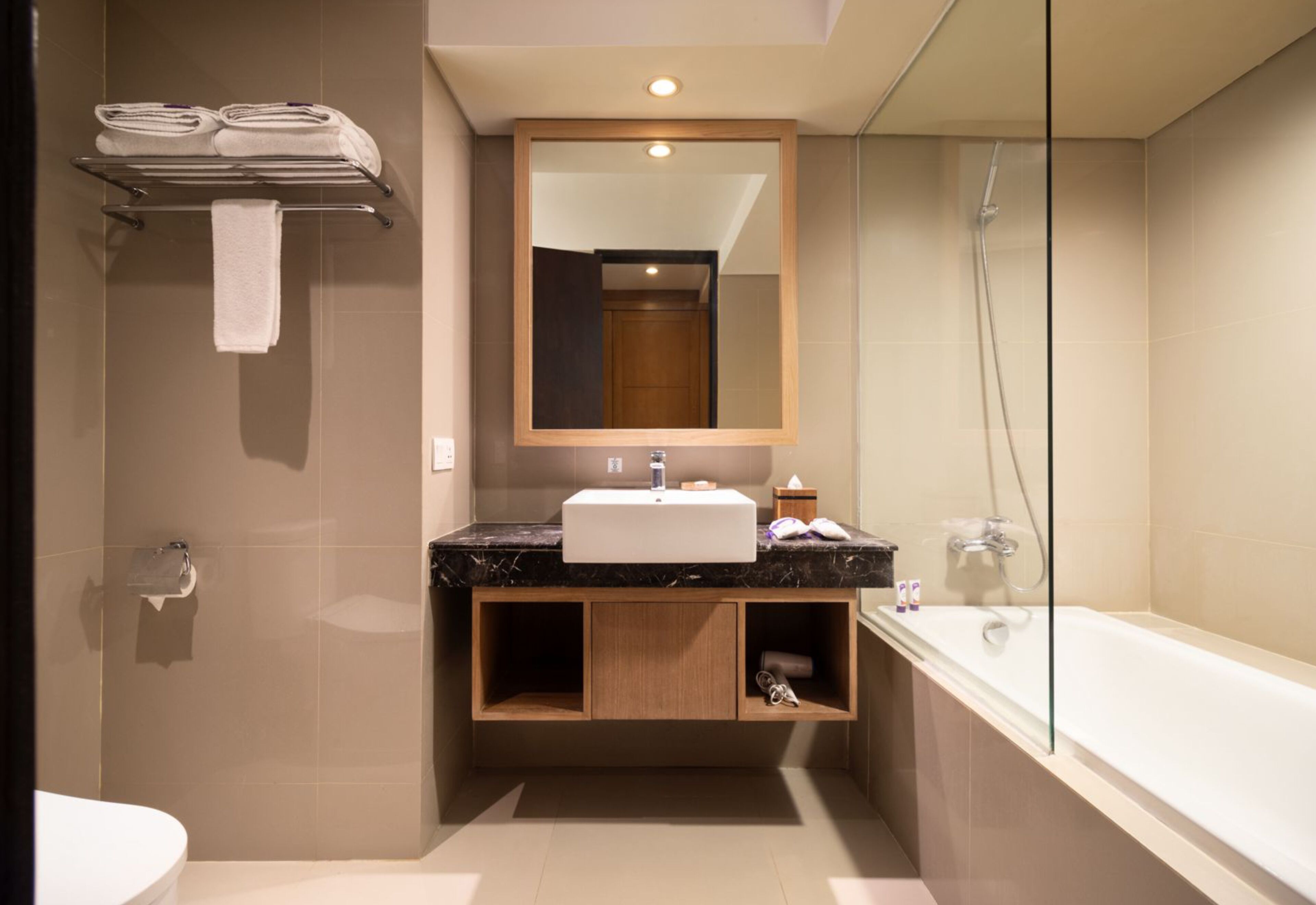 deluxe room with bathtub | bathroom | free toiletries, hair dryer, bathrobes, slippers