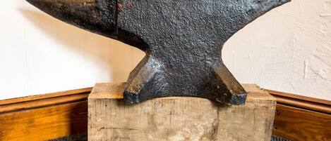 An anvil on a wooden block.