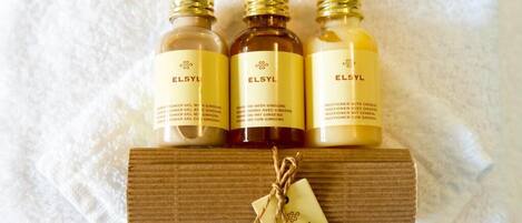 Three bottles of ELSYL on a wooden shelf with a tag.