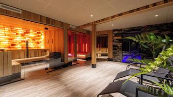 Relax in our inviting lobby, featuring a reception area with a clear view, comfortable seating, and a unique illuminated wall.