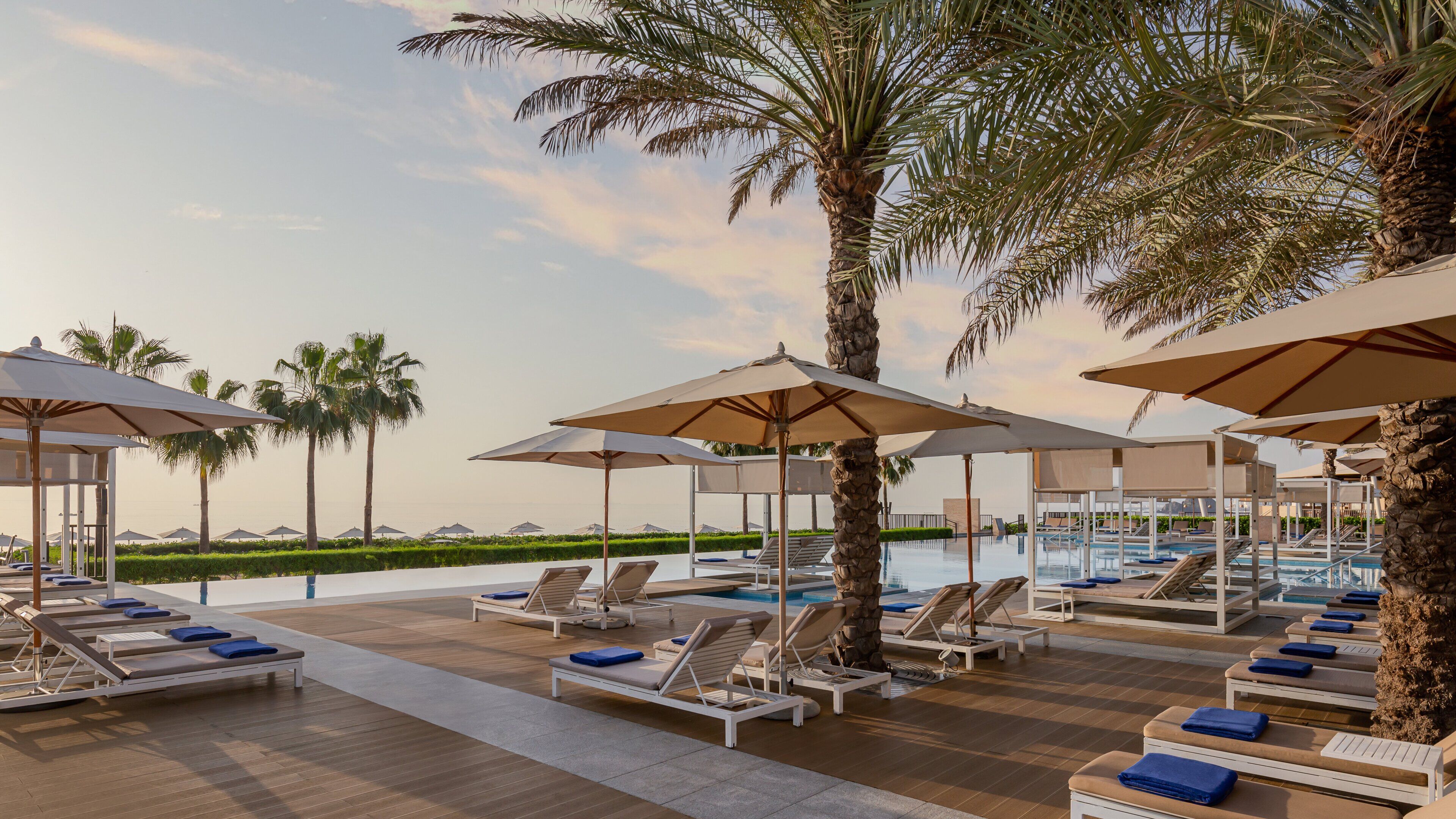 4 outdoor pools, open 7:00 AM to 8:00 PM, pool cabanas (surcharge)