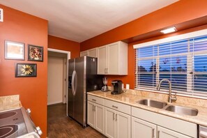 Condo, 2 Bedrooms | Private kitchen | Fridge, microwave, coffee/tea maker