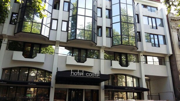 A multi-story hotel with large windows and balconies. - Hotel Costé (Tbilisi)
