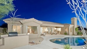 A two-story house with a swimming pool, outdoor seating area, and a barbecue grill. - Casa De Luna By Signature Vacation Rentals (Scottsdale)