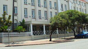 A multi-story hotel with a flat facade, large windows, and a sign reading "BALMORAL".