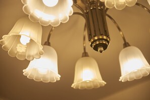 A chandelier with multiple white glass shades.