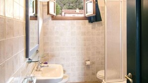 A bathroom with a sink, toilet, and bathtub.