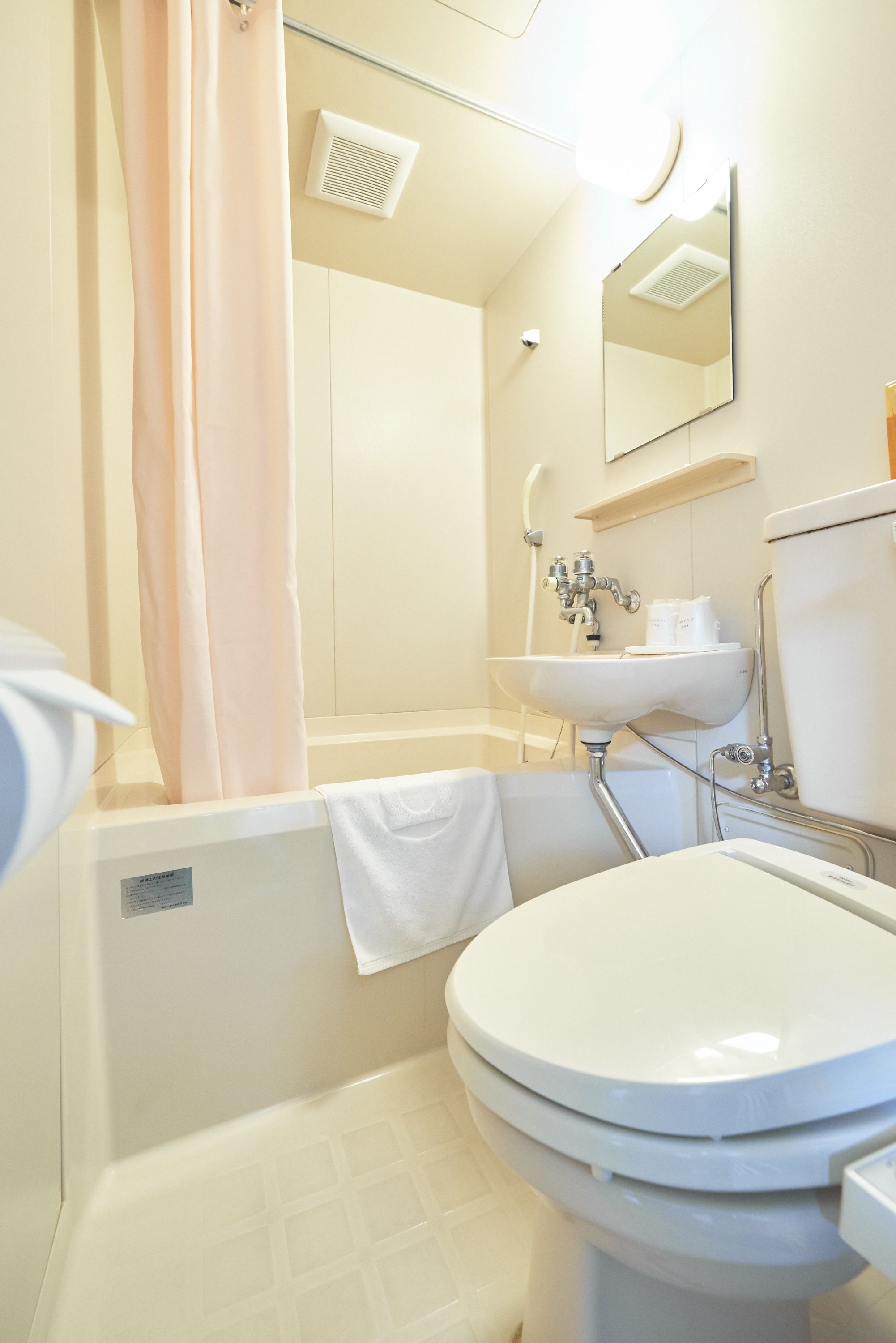 Combined shower/tub, free toiletries, hair dryer, slippers