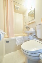 Combined shower/tub, free toiletries, hair dryer, slippers