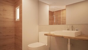 A modern bathroom with a wooden accent wall, a toilet, a shower, and a vanity with a mirror.