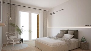 Ein modernes Schlafzimmer mit einem großen Bett, einem Sessel, einer Topfpflanze und einer Wand mit einem Zitat.