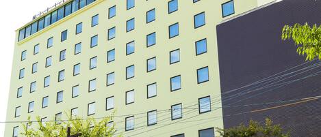 A multi-story hotel with a prominent sign reading "Select Royal Hotel."