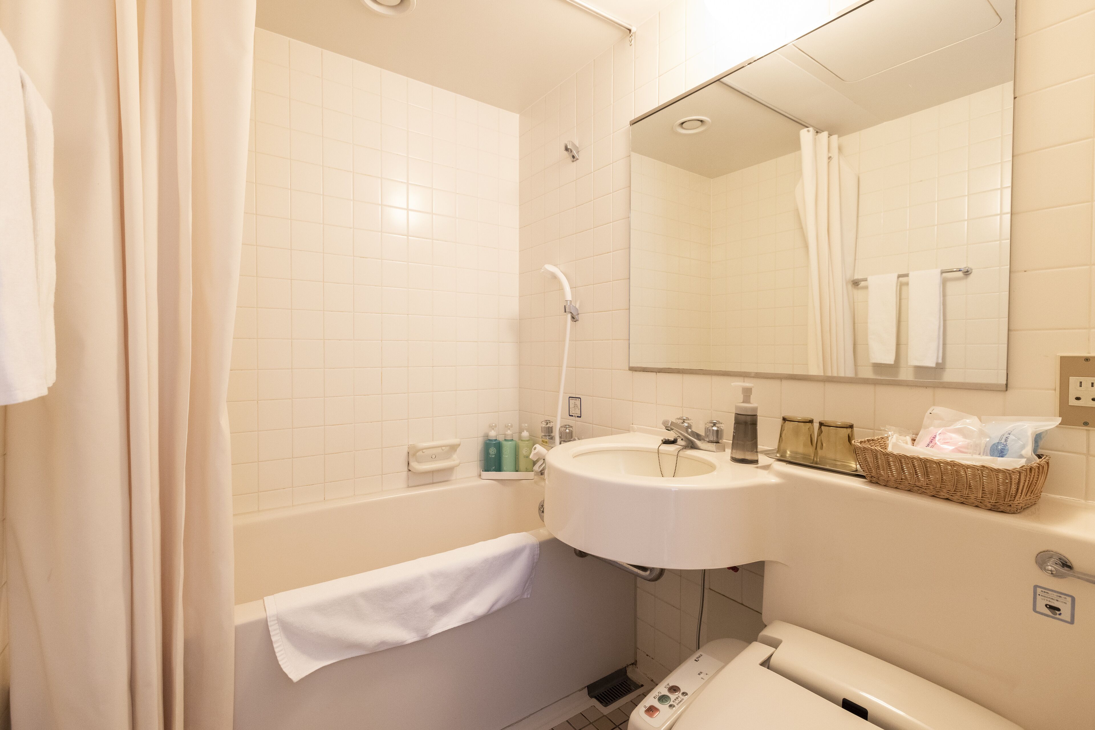 junior suite | bathroom | shower, free toiletries, hair dryer, slippers